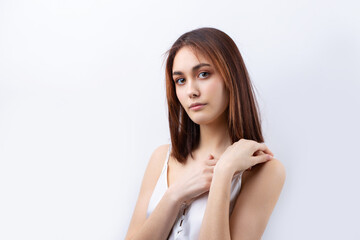 Naklejka premium Beautiful smiling woman with clean skin, natural make-up and white teeth on a gray background
