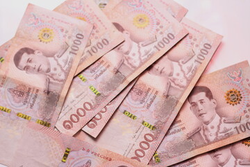 1000 baht Thai banknotes placed on a white background.
