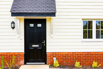 Close up of a front door on a brand new affordable home aimed at first time buyers to get them onto the housing ladder