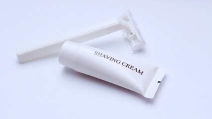shaving cream and razor on white background.