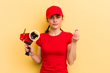 young pretty woman making capice or money gesture, telling you to pay. packer concept