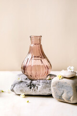 Beautiful pink transparent bottle of perfume with flowers - 490107734