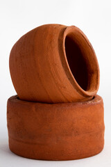 A close-up of two clay pots of two clay pots. Close-up of clay products.