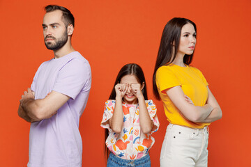 Young strict angry serious parents mom dad with sad crying child kid daughter teen girl wearing...