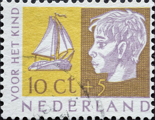 Netherlands - circa 1953: a postage stamp from the Netherlands , showing a portrait of a Boys Head...