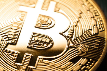 Bitcoin B logo. Macro photo of shiny gold coin symbol detail. Simple bright golden bitcoin crypto...