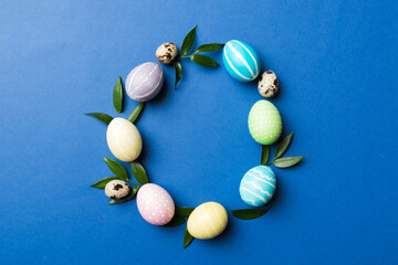 round frame Multi colors Easter eggs on colored background . Pastel color Easter eggs holiday concept with empty space for you design