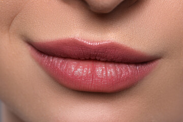 Fototapeta premium Young woman with beautiful plump lips, closeup