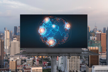 Glowing hologram of Earth planet map on billboard over aerial panoramic cityscape of Kuala Lumpur at sunset, Malaysia, Asia. The concept of international business in KL.