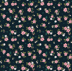 Beautiful floral pattern in small abstract flowers. Small pink flowers. Dark Blue background. Ditsy print. Floral seamless background. The elegant the template for fashion prints. Stock pattern.