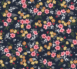 Cute floral pattern with flowers. Seamless vector pattern. Elegant template for fashion prints. Small pale pink and yellow flowers. Dark blue background. Summer and spring motifs. Stock vector.