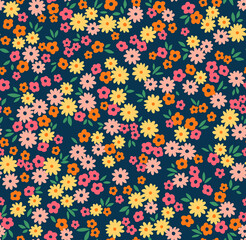 Fototapeta na wymiar Beautiful floral pattern in small abstract flowers. Small colorful flowers. Dark Blue background. Ditsy print. Floral seamless background. The elegant the template for fashion prints. Stock pattern.