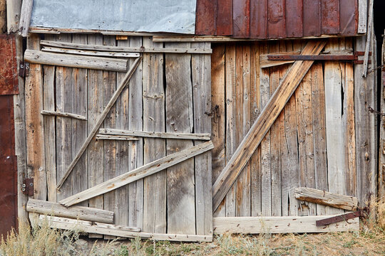 gate of the old barn made of boards