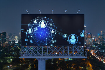 Fototapeta premium Glowing Social media icons on billboard over night panoramic city view of Bangkok. The concept of networking and establishing new connections between people and businesses in Southeast Asia