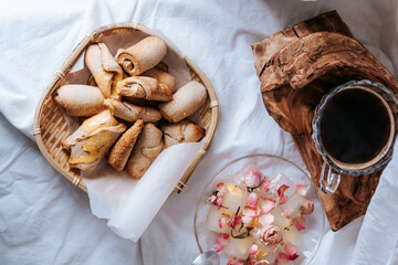 Top view photo of breakfast with croissants and coffee. Homemade baking. A cup of freshly brewed black coffee.