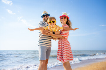 Happy family having fun on summer vacation - 490118395