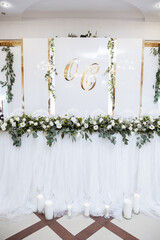 Beautiful wedding arch of flowers for the newlyweds. Decoration on a holiday