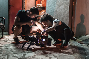 Behind scenes. Film crew team shooting movie scene. Group filmmaking