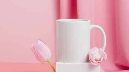 Fototapeta na wymiar Spring mockup mug banner with tulip flowers on pink background, mug for branding, logo and design