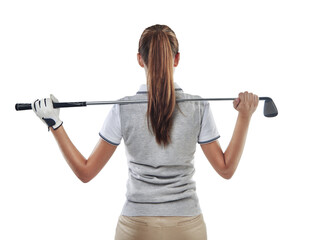 In command of her club. Studio shot of a young golfer holding a golf club behind her back isolated...