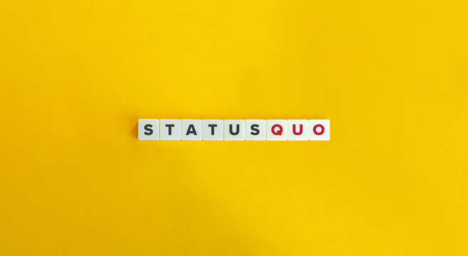 Status Quo Latin Phrase on Letter Tiles on Yellow Background. Minimal Aesthetics.