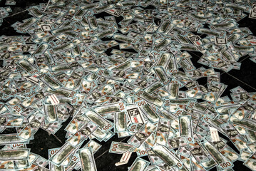 Counterfeit dollars on the ground
