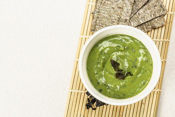 Kelp puree isolated on white background. Healthy superfood from oceanic seaweed