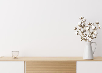 Empty white wall. Mock up interior in contemporary style. Close up view. Free space, copy space for your picture, text, or another design. Sideboard, cotton plant. 3D rendering.