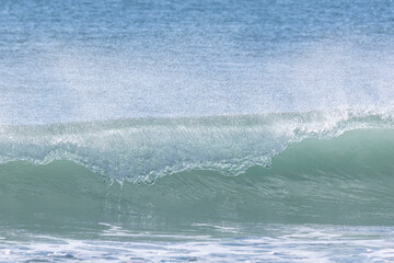 Wave breaking in the sea.