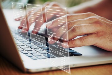 Businessman working on laptop computer with electronics document icons, management, online documentation