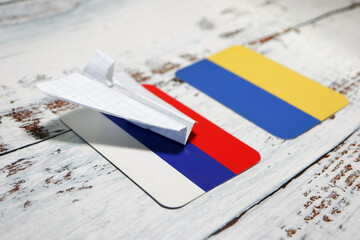 no travel by plane closed sky because of war conflict between Russian and Ukraine paper plane with...