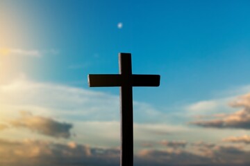 The wooden Cross at the sunset sky background