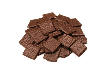 Dark chocolate candies isolated on white background.