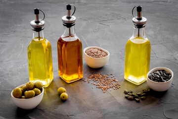 Cooking oil in bottles. Sunflower olive and sesame oil with ingredients