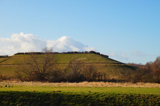 The Frankfurt-Heddernheim landfill in winter against a blue sky.