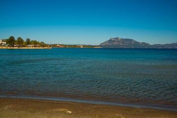 DATCA, TURKEY: Beautiful view from the beach to the sea and mountains in the town of Datca on a sunny day.