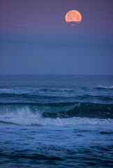 Full moon setting on the coast 