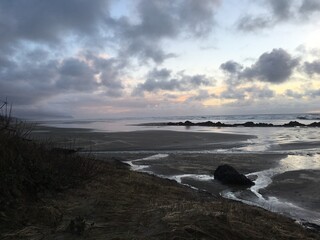Romantic Stroll Along Pacific Northwest Coastline at Sunset