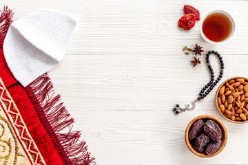 Ramadan Kareem greeting card. Table with dates fruits nuts and islamic rosary