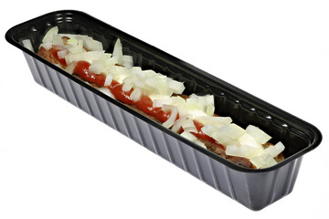 Dutch frikandel speciaal in a black plastic container isolated on white background