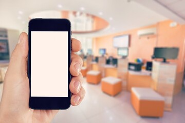 Human hand holding smartphone with a blank screen