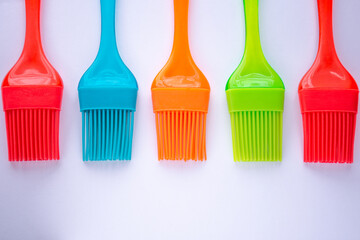 Line of colored silicone brushes.