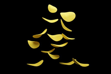 Crispy potato chips flying in the air. On an black background. Fast food.