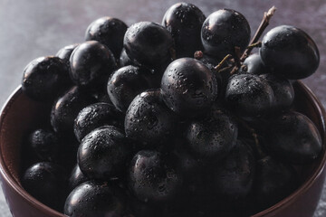 fresh black grapes with water drops closeup