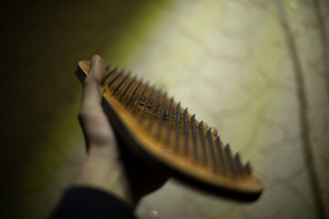 Board with nails. Tool for practicing yoga. Small nails stick out of board.
