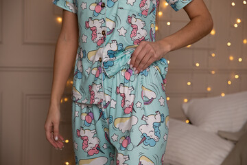 girl in blue pajamas with unicorns