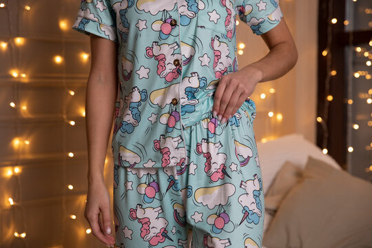 Girl In Blue Pajamas With Unicorns