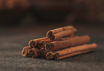 Bunch of cinnamon sticks closeup. Aromatic cinnamon sticks.