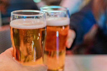 Cheers. Close-up of two glasses of beer.