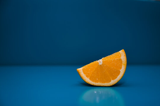 Orange slice with blue background